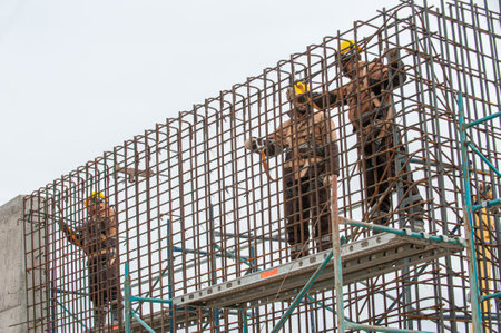 The men working on scaffolding