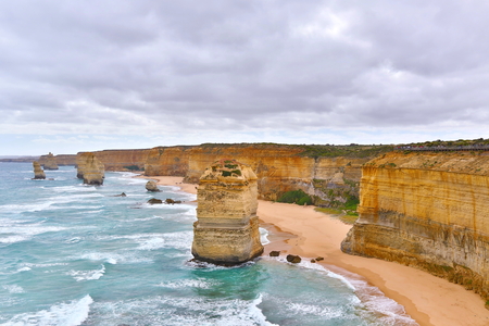The Twelve Apostles is a collection of limestone stacks off the shore of the Port Campbell National Park, by the Great Ocean Road in Victoria, Australia.の写真素材