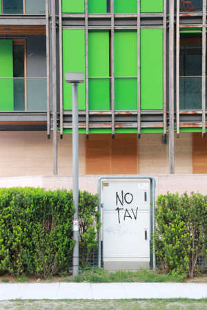 Graffiti no tav in Renzo Piano Residential Building (Le Albere) in Trento Italy.のeditorial素材