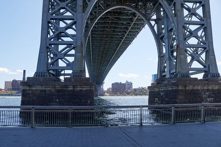 Photo of manhattan bridge in the city of new york from a low angle viewの写真素材