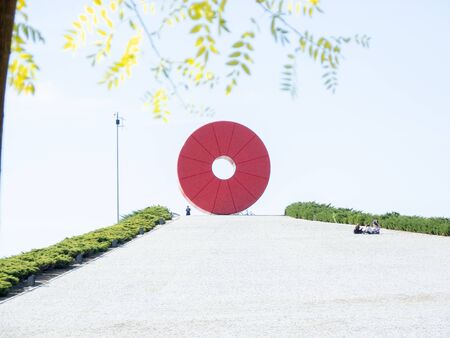 Photo of a sculpture of a red donut