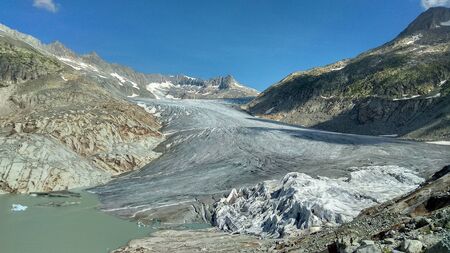 Photo of a glacier and a lake in Switzerlandの写真素材