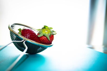 Photo of red strawberries in a strainerの写真素材