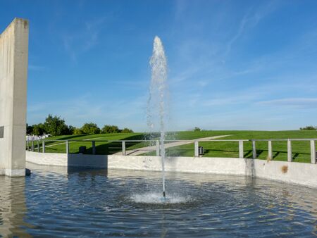 Photo of a fountain in a park during the dayの写真素材
