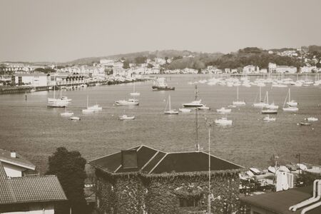 Photo of ships in the sea with sepia-tonedの写真素材