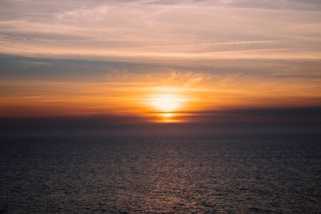 Photo of the sunset with the seaの写真素材