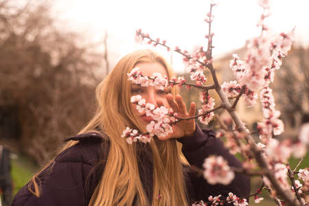 Girl with spring flowers and spring conceptの写真素材