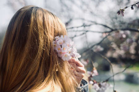 Girl with spring flowers and spring conceptの写真素材