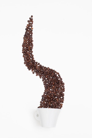 Cup of coffee and some coffee beanの写真素材