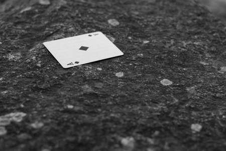 Ace card over the rocksの写真素材