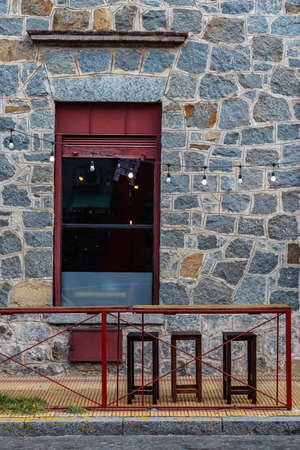 Table and stools in the street of a brewery.の写真素材