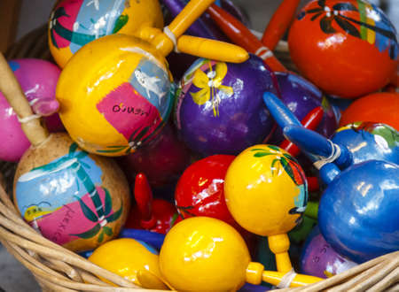 A basket full with colorful hand painted Maracas (rattlers) from Mexico