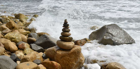 tower of stones on the beachの写真素材