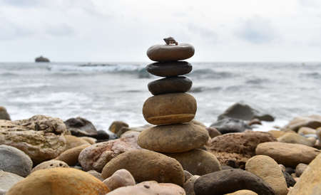 a tower of stones on the seaの写真素材