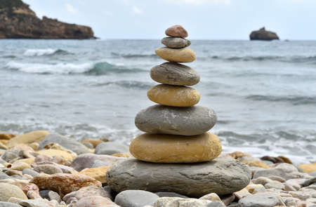 a tower of stones on the beach