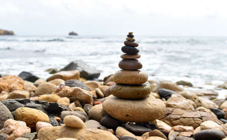 a tower of stones on the beachの写真素材