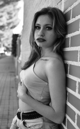 Portrait of a young woman in a black and white photo.の写真素材