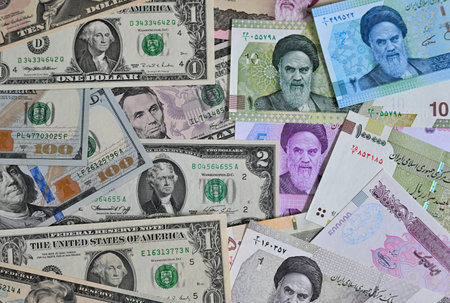 Background of different american dollars and iranian rials banknotes