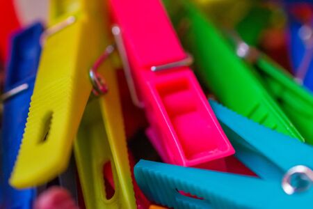 macro detail of a lot of colored clothespinsの写真素材