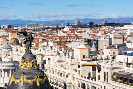 Panoramic aerial view of the city of madrid with the skyline of the sierra mountainsの写真素材