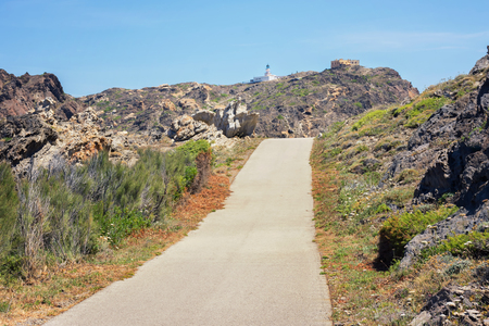 view of a street crossing the rocks in the natural park of Cap de Creus in Catalonia (Spain)の写真素材