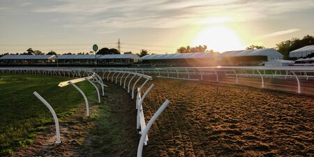 Grounds of a horse race at sunset timeの写真素材