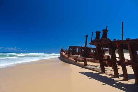 Wreckage on the beach outside the waterの写真素材