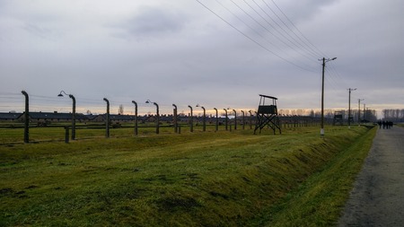 Sunset with moody cloudscape at Auschwitz concentration campのeditorial素材
