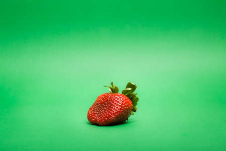 Strawberry fruit on green backgroundの写真素材