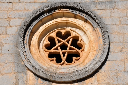 The pentalpha of a rose window, St Bartholomew hermitage, Spainの写真素材