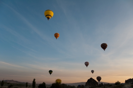 Hot air balloon flies over Cappadocia, the best attraction for tourists, on April 30, 2013 in Cappadocia, Turkeyのeditorial素材