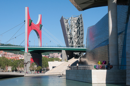 Nervion river, La Salve bridge and Guggenheim Museum on June 12, 2013 in Bilbao, Spain  Modern city near Nervion river のeditorial素材