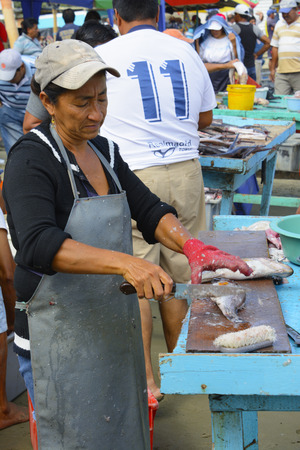 A traditional fish market on the beach on September 3, 2014 in Puerto Lopez, Ecuador.のeditorial素材