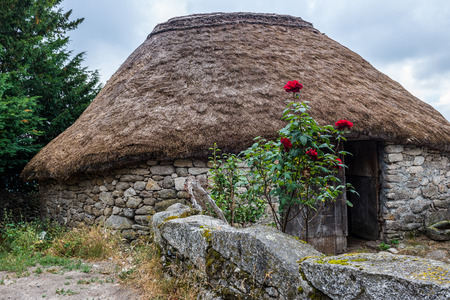 Palloza, traditional thatched roof house in Piornedo, Lugo, Spainのeditorial素材