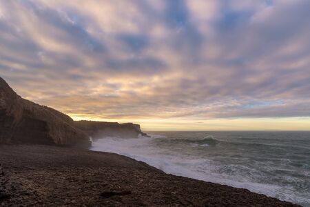Rocky coast of Ajo Cape at sunset, Cantabrian Sea, Cantabria, Spain
