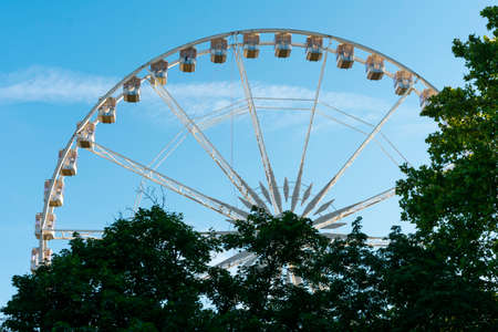 Large ferris wheel against a blue skyの写真素材