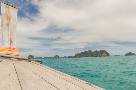 Long Tail Boat Traveling through the sea of Thailandの写真素材