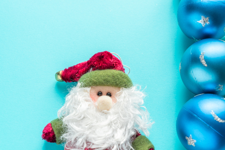 Santa Claus an blue Christmas Balls on a beautiful blue backgroundの写真素材