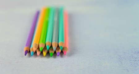 Colored pencils on a white backboardの写真素材