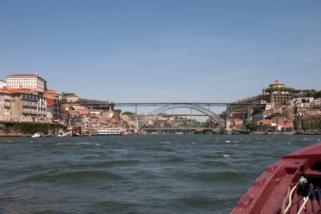 The Luis I bridge is a metal arch bridge that spans the Douro river between Porto and Vila Nova de Gaia. It was designed by a student of Eifel and has the same iron appearance as does the Parisian tower.の写真素材