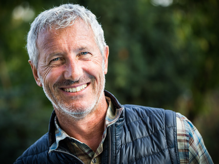 Portrait of a mature handsome man in an outdoor environmentの写真素材
