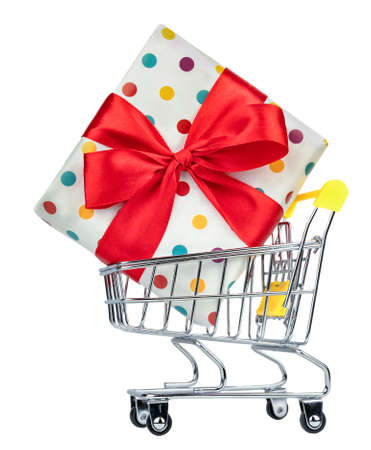 Close-up of shopping trolley cart with colorful gift isolated on white background.の写真素材