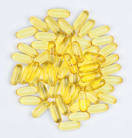 Heap pills of fish oil capsules. top view.の写真素材