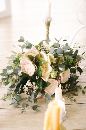Bride holding the wedding bouquet, with succulent flowers, close-upの写真素材