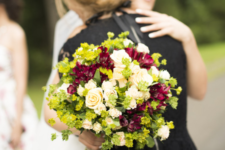 Elegant bride and groom posing together outdoors on a wedding dayの写真素材