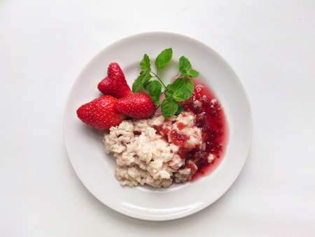 oatmeal porridge with strawberries and jamの写真素材