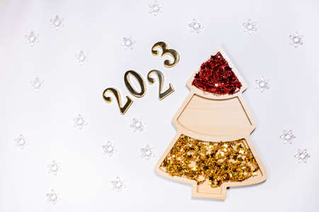 2023 number on white background near new year tree decoration