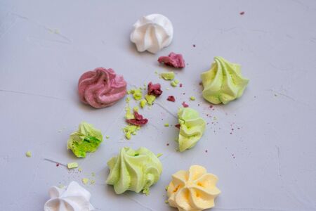 colored meringue sweets, marshmallows, cake