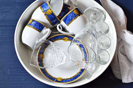 Cleaned dishes in a big bowlの写真素材