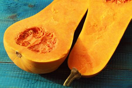 Muscat pumpkin on blue rustic background. Seasons, autumn vegetablesの写真素材